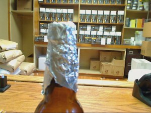 Tinfoil around bottle